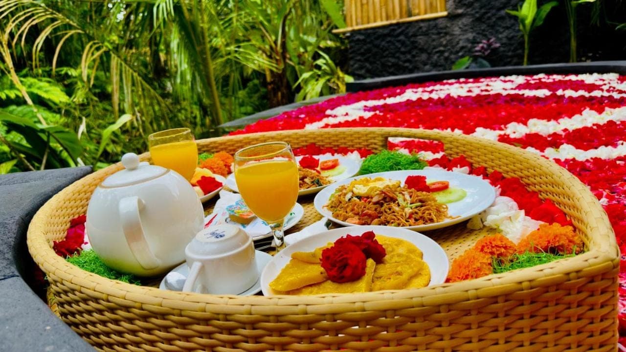a basket filled with food and drinks on a table at Phoenix Bamboo House by Ecobreeze in Sidemen