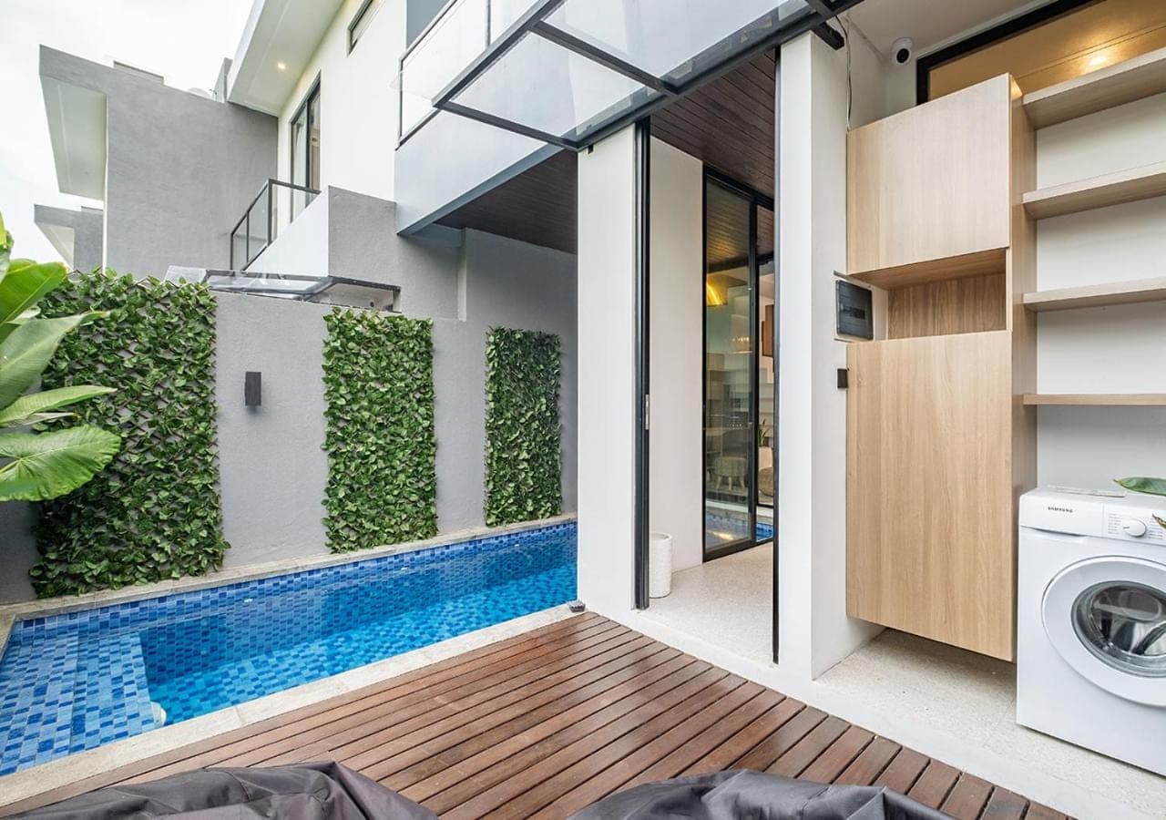 a house with a swimming pool in the backyard at Private Villa Ayra 8B by OriVista 10min to Melasti Beach in Uluwatu
