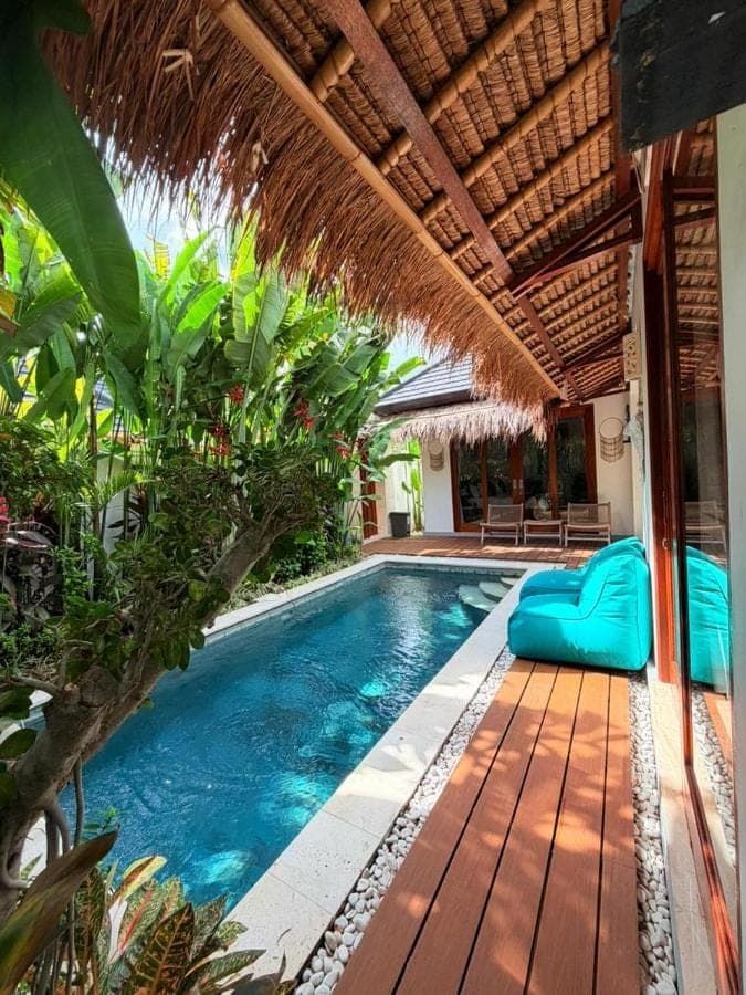a swimming pool in a villa with a resort at Kubu Dimel Suites and Villas Resort in Nusa Dua
