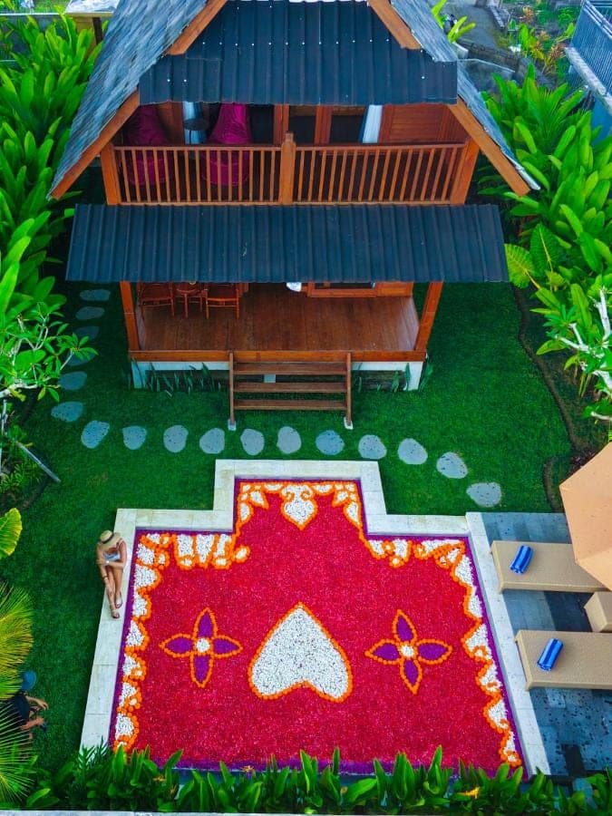 a model of a house with a red carpet in front of it at Romantic Wooden House with Private Pool in Ubud - Raka d'Uma in Ubud