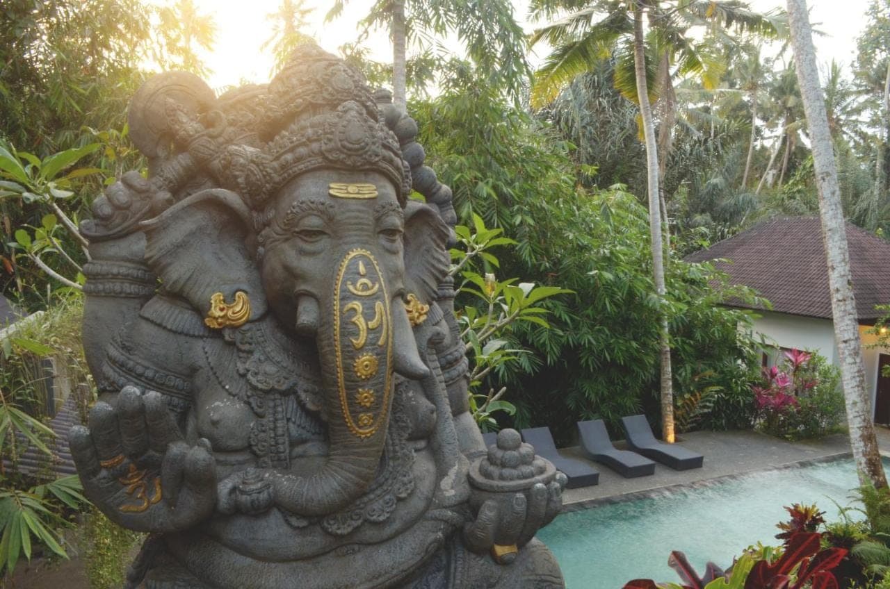 a statue of an elephant in a garden at The Bali Shanti in Ubud