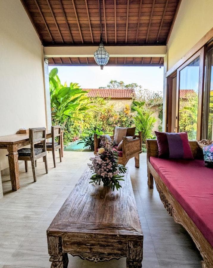 a living room with a couch and a table at Villa Ulun Mertha - 1BR Private Villa in Ubud