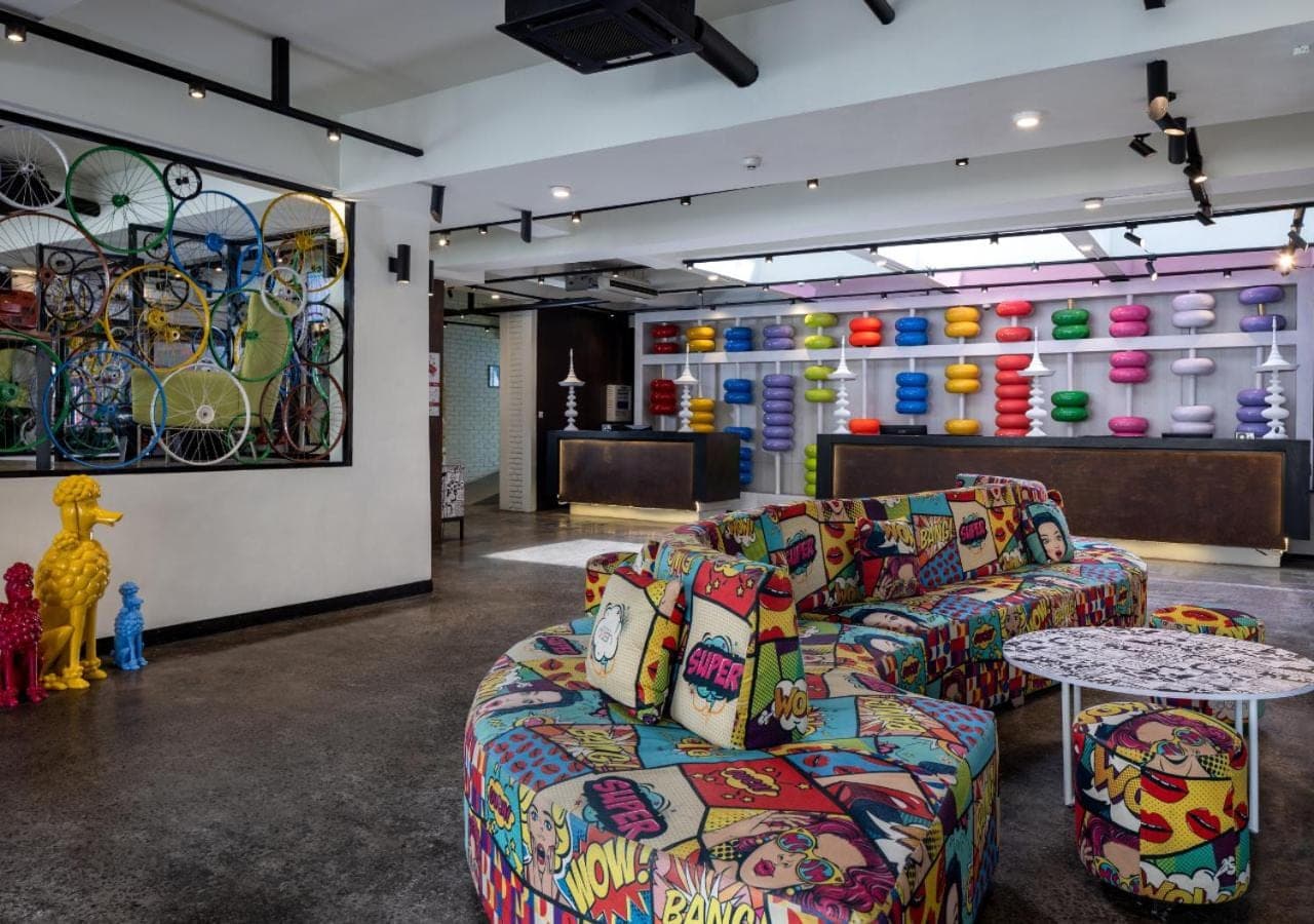 a living room with two couches and a table at Viva Dash Hotel Seminyak in Seminyak