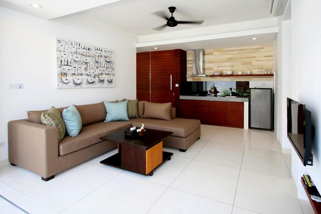 a living room with a couch and a table at Smart Comfort Apartments in Sanur