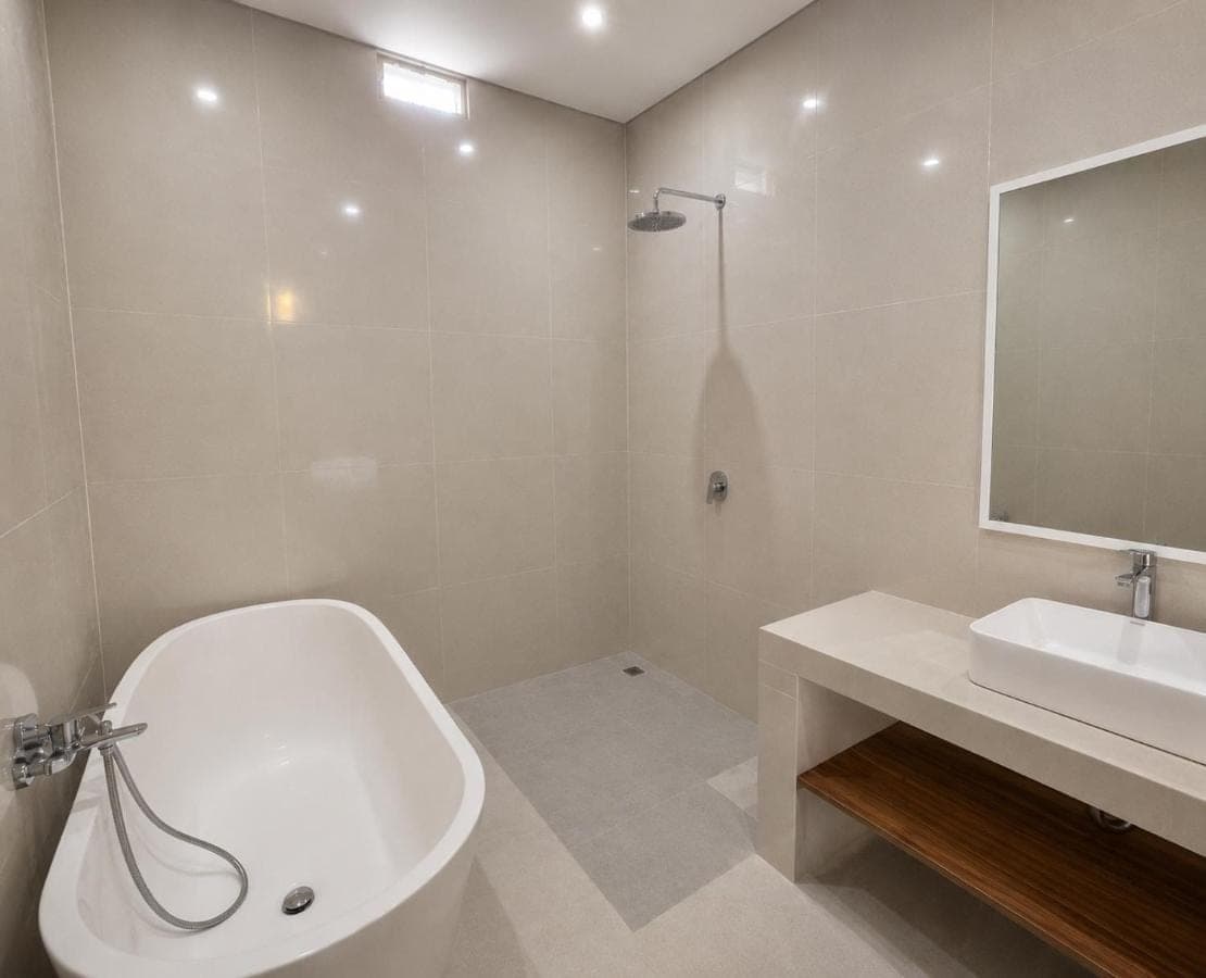 a white bathroom with a tub and a sink at Mahayasa Hidden Retreats 1BR Garden Villa in Canggu