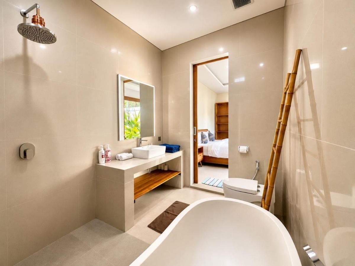 a bathroom with a tub and a sink and a mirror at Mahayasa Hidden Retreats 1BR Garden Villa in Canggu