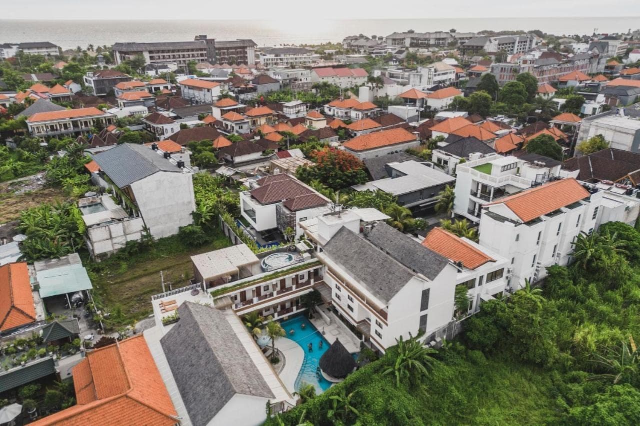 an aerial view of a city with buildings at Roomates Beach Hostel Canggu by Ini Vie Hospitality in Canggu