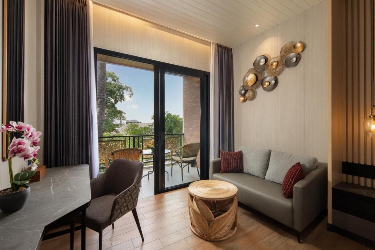 a living room with a couch and a table at Amankara Canggu in Canggu