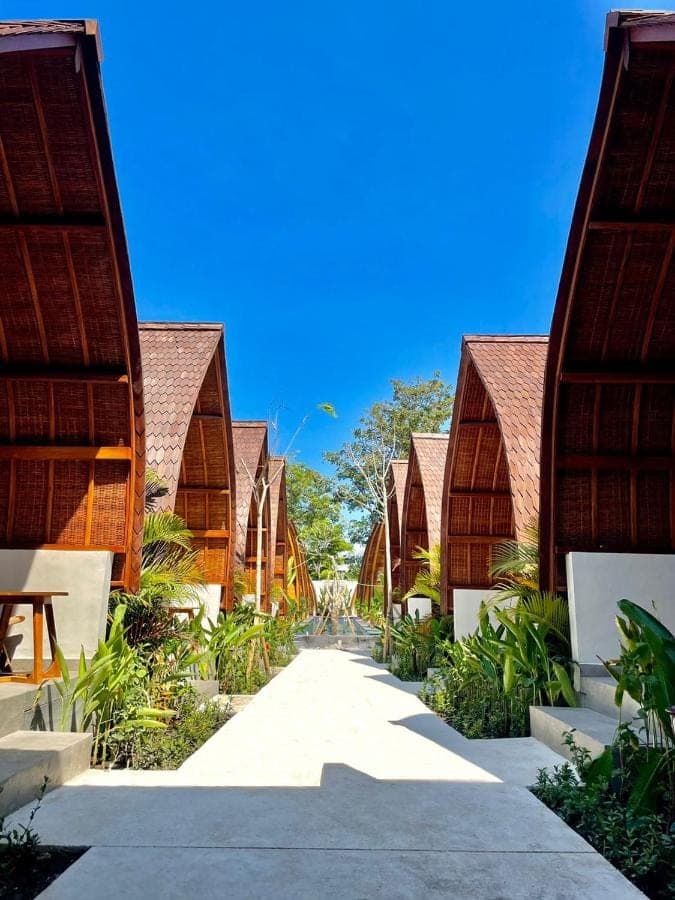 a path between the buildings of a resort at Abian Klumpu Villa & Spa Sanur Bali in Sanur
